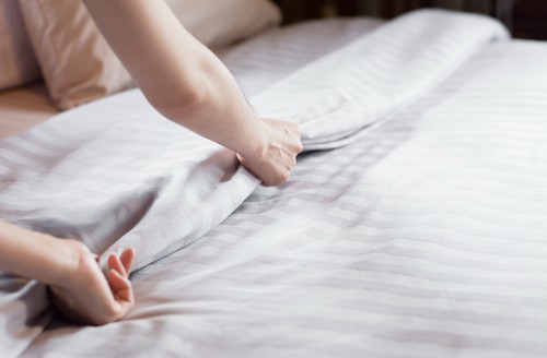 Changing bedsheet